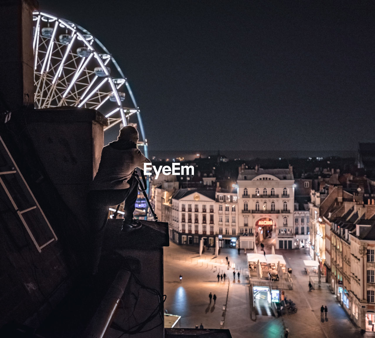 VIEW OF ILLUMINATED CITYSCAPE