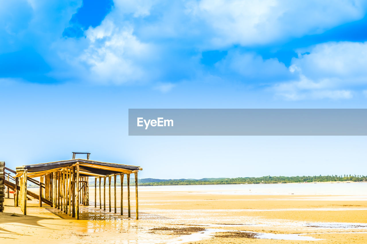 Built structure at beach against sky