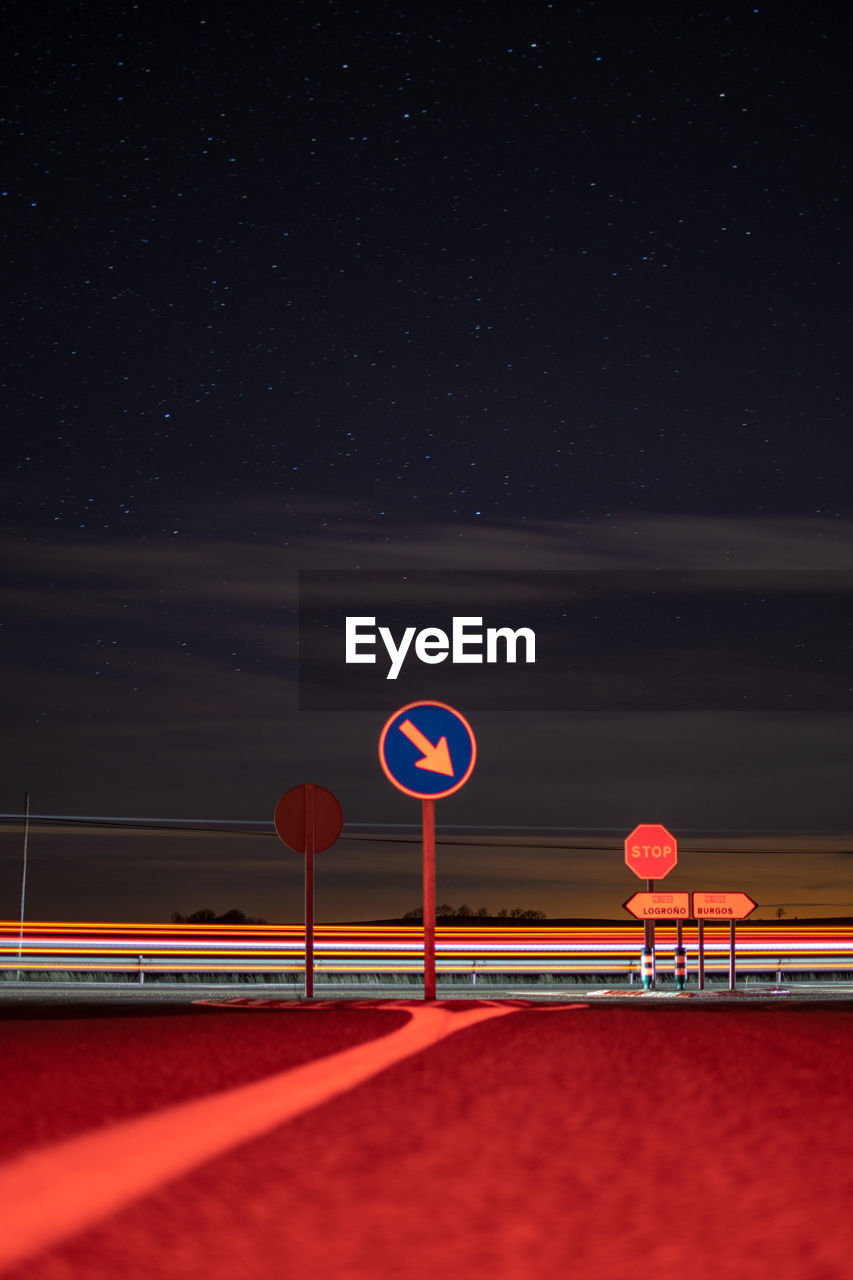 ROAD SIGN AGAINST CLEAR SKY