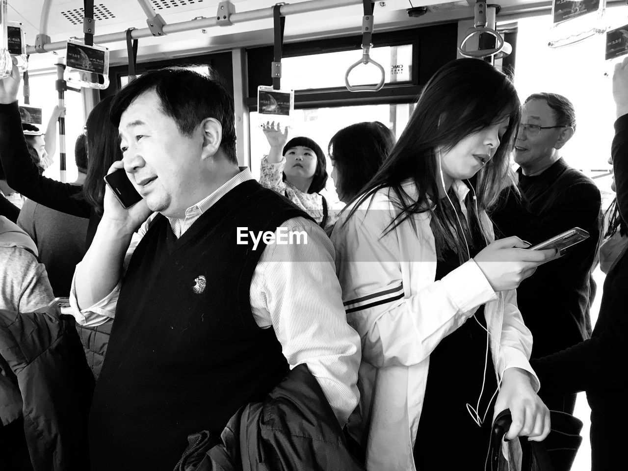 PEOPLE SITTING IN TRAIN