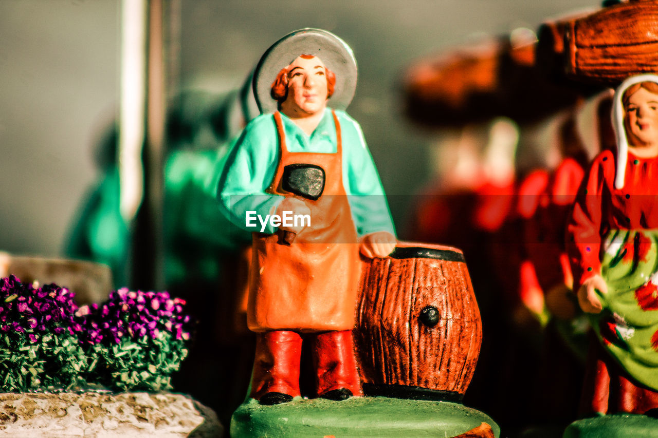 Close-up of figurine for sale at market