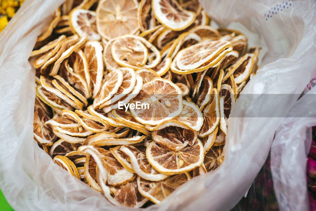 High angle view of dry lemon slices for sale at market