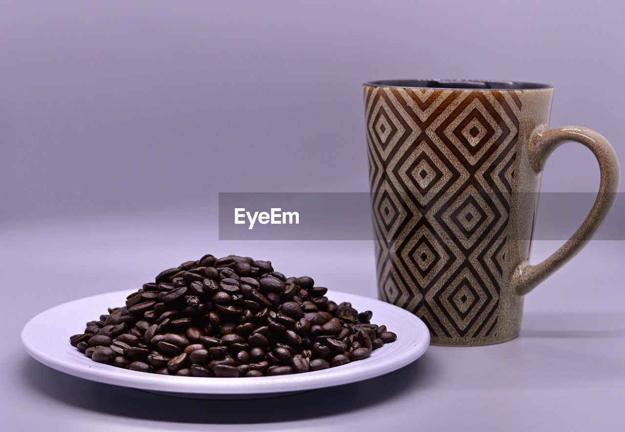 Close-up of coffee beans on table