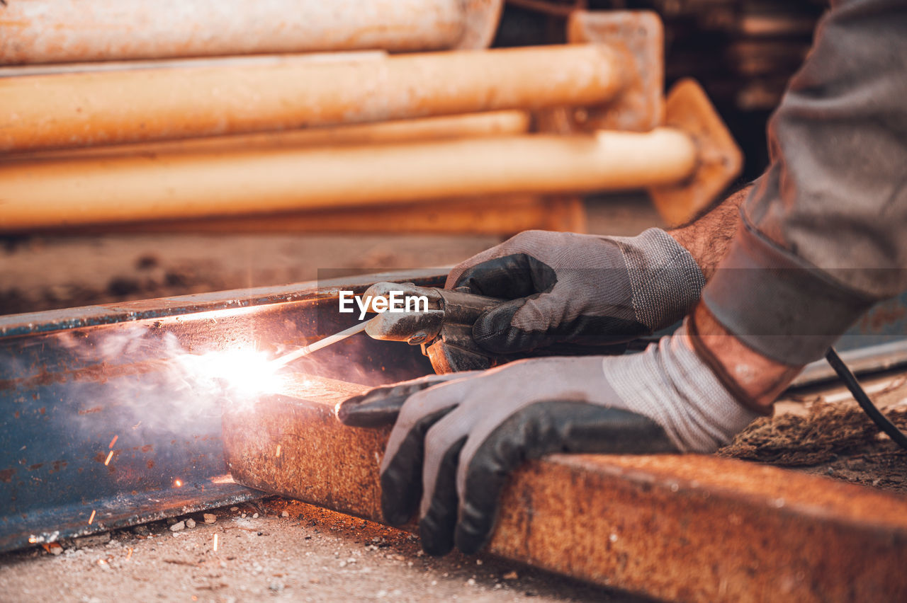 MAN WORKING ON WOOD