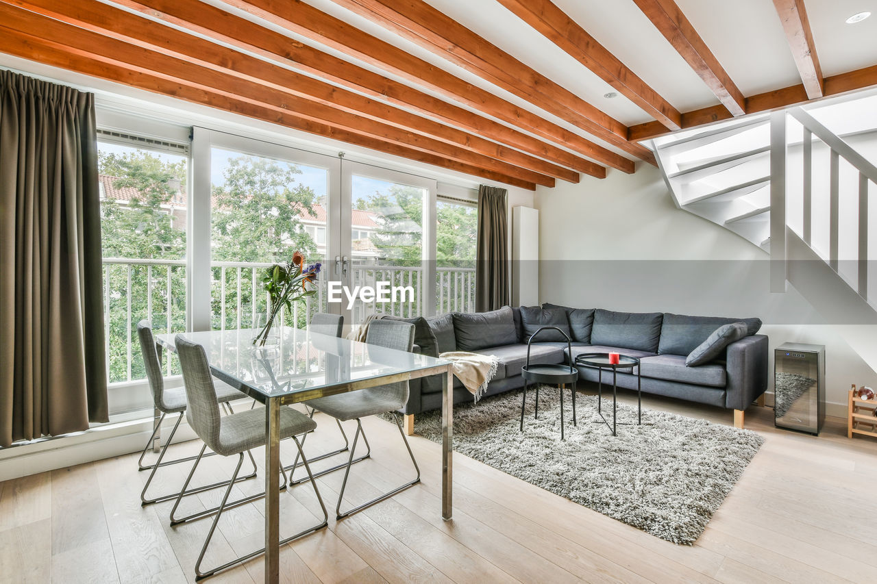 Chairs and table on sofa at home