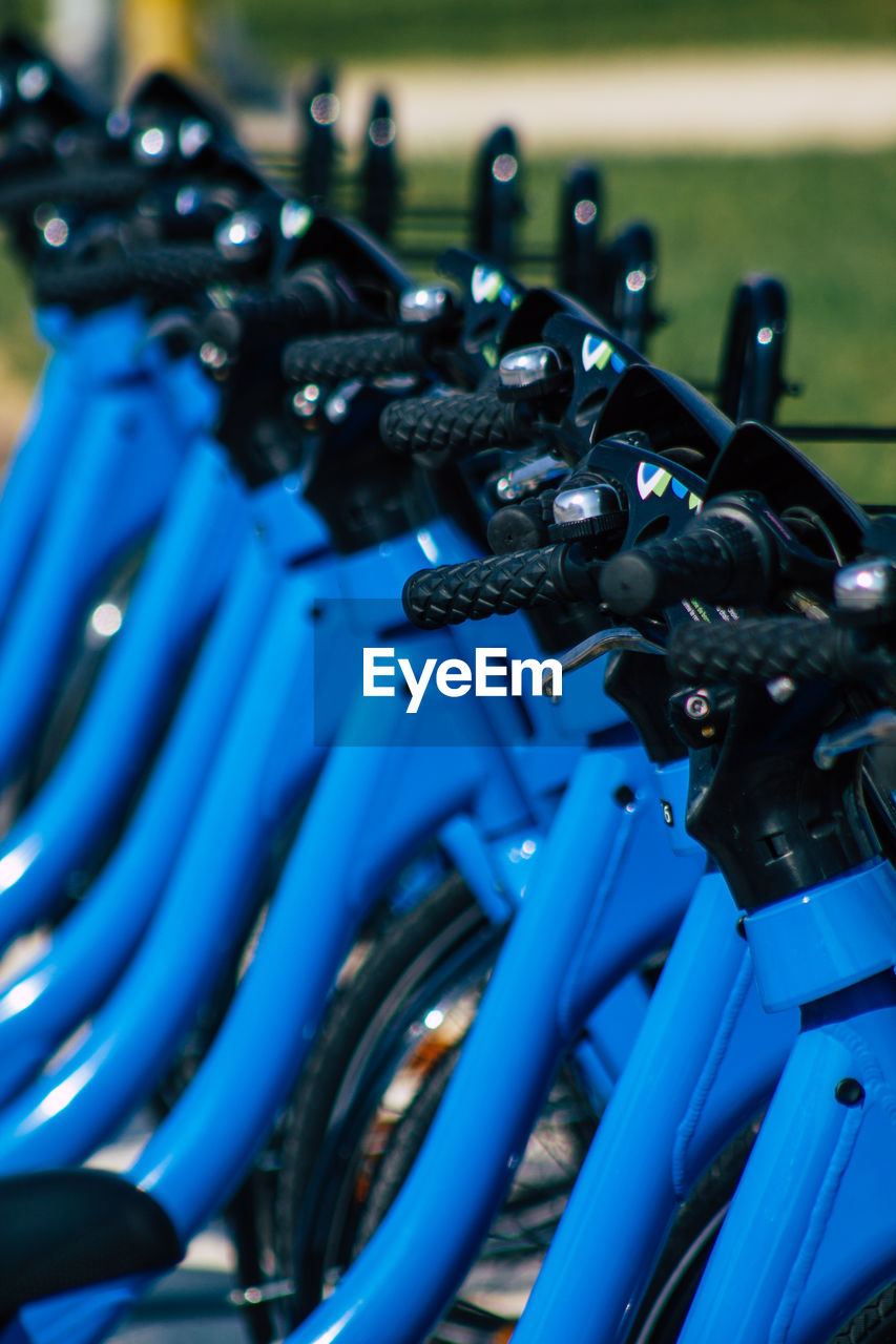 CLOSE-UP OF BICYCLES ON METAL