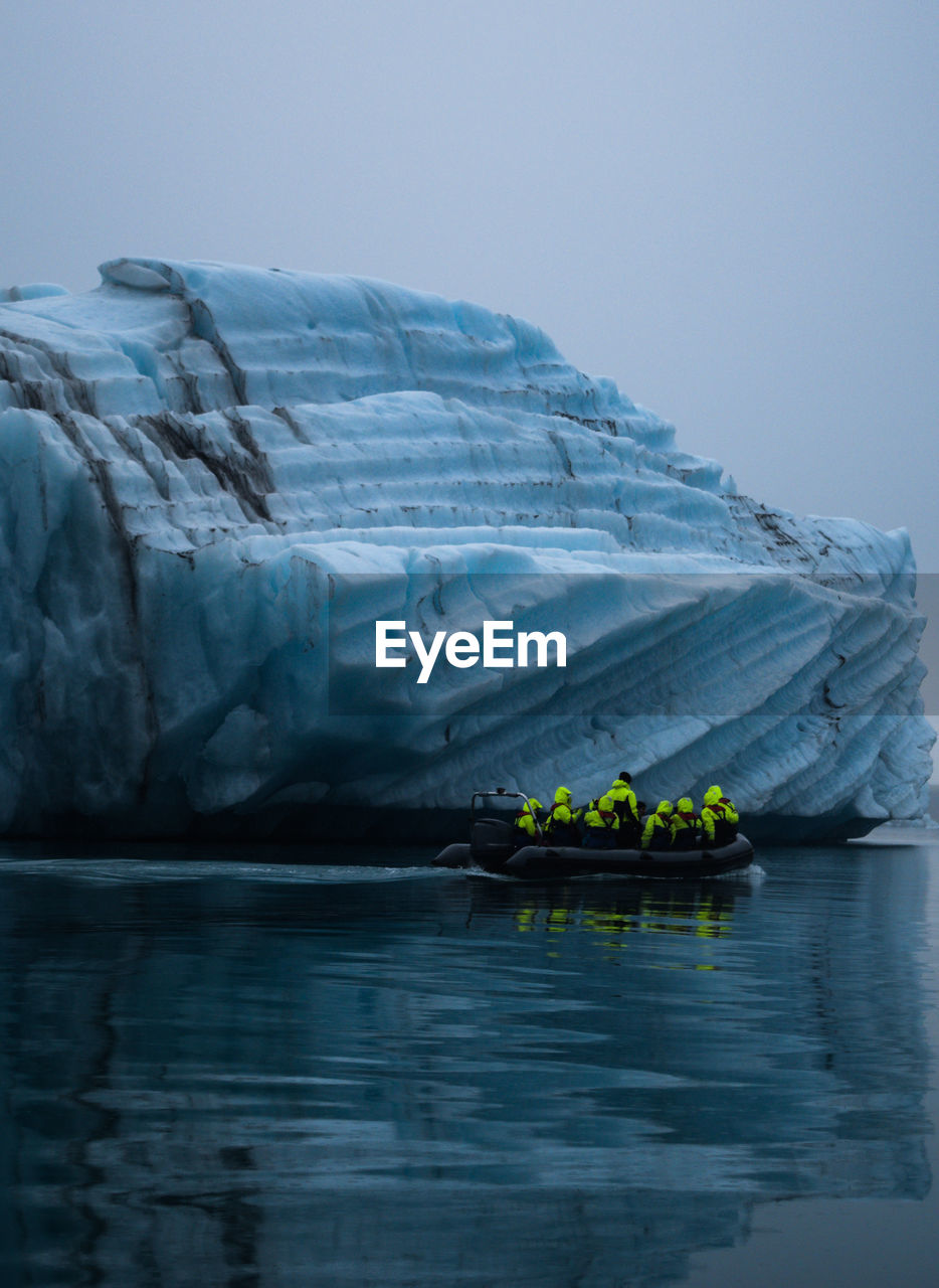 SCENIC VIEW OF ICEBERGS AGAINST SKY