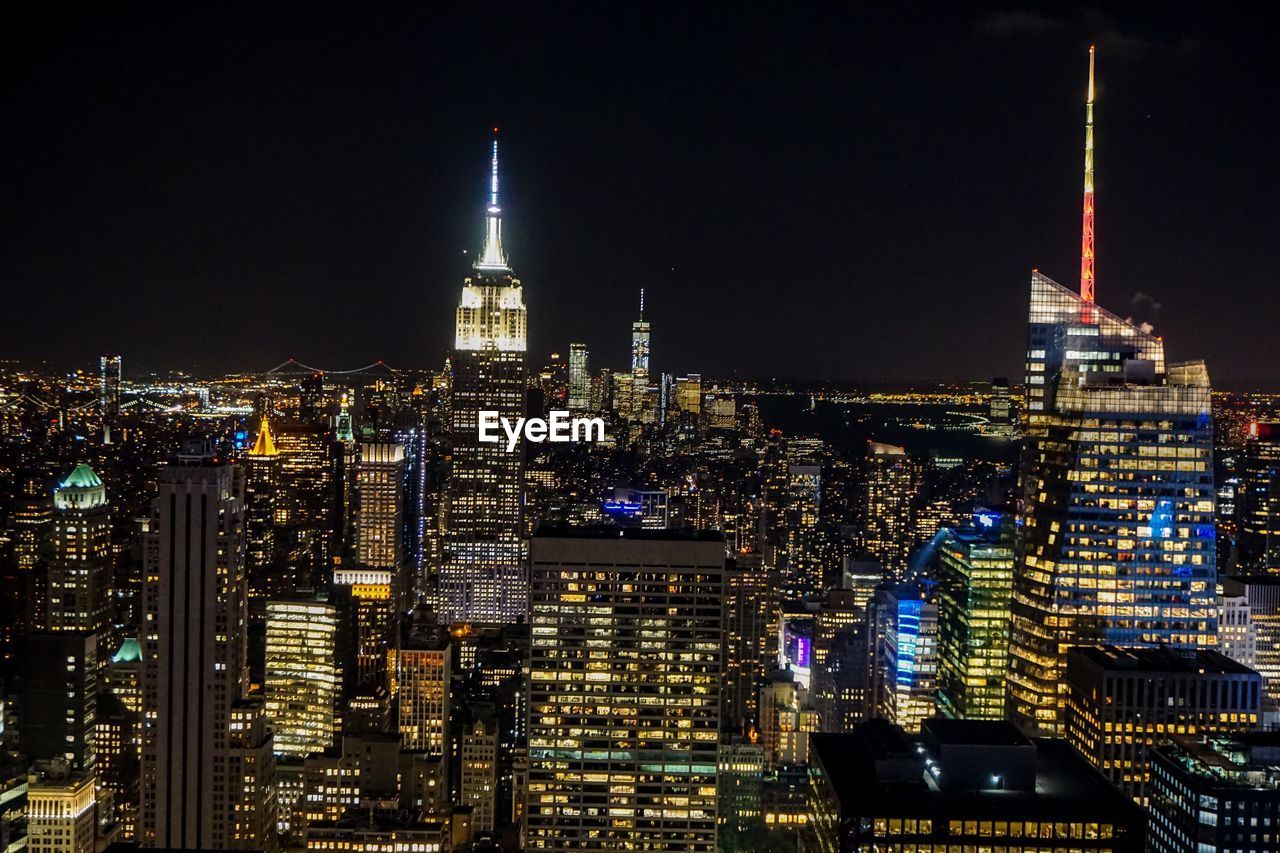 Illuminated buildings in city at night