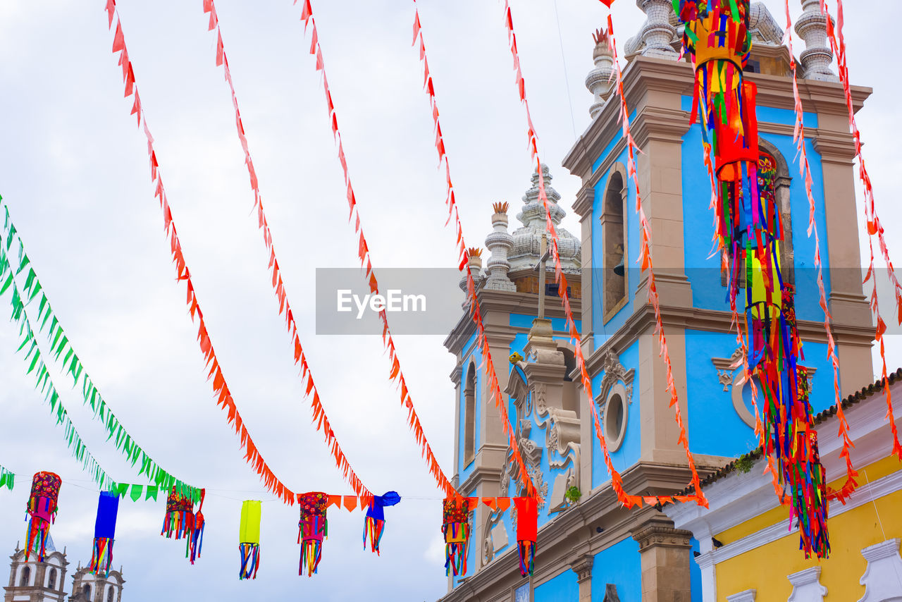sky, hanging, architecture, low angle view, nature, multi colored, built structure, decoration, no people, outdoors, day, celebration, event, tradition, rope, travel destinations, cloud
