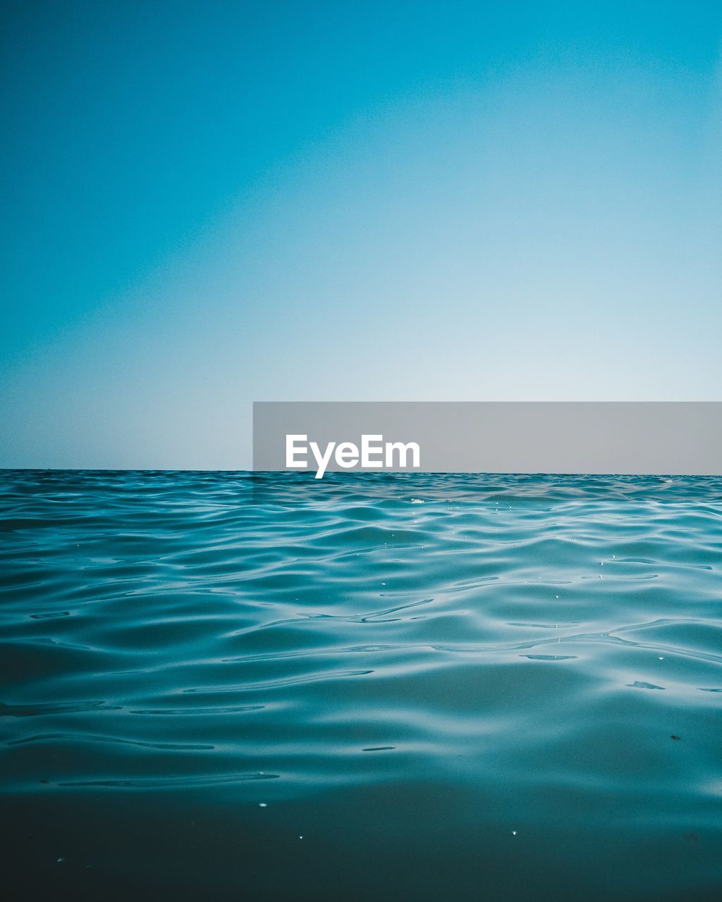 VIEW OF SEA AGAINST CLEAR BLUE SKY