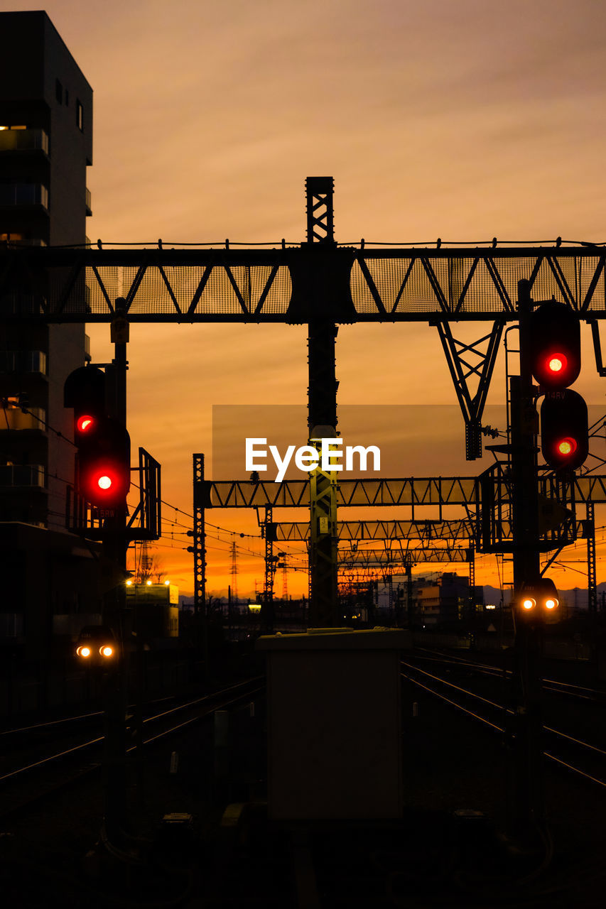 Illuminated bridge against sky at night