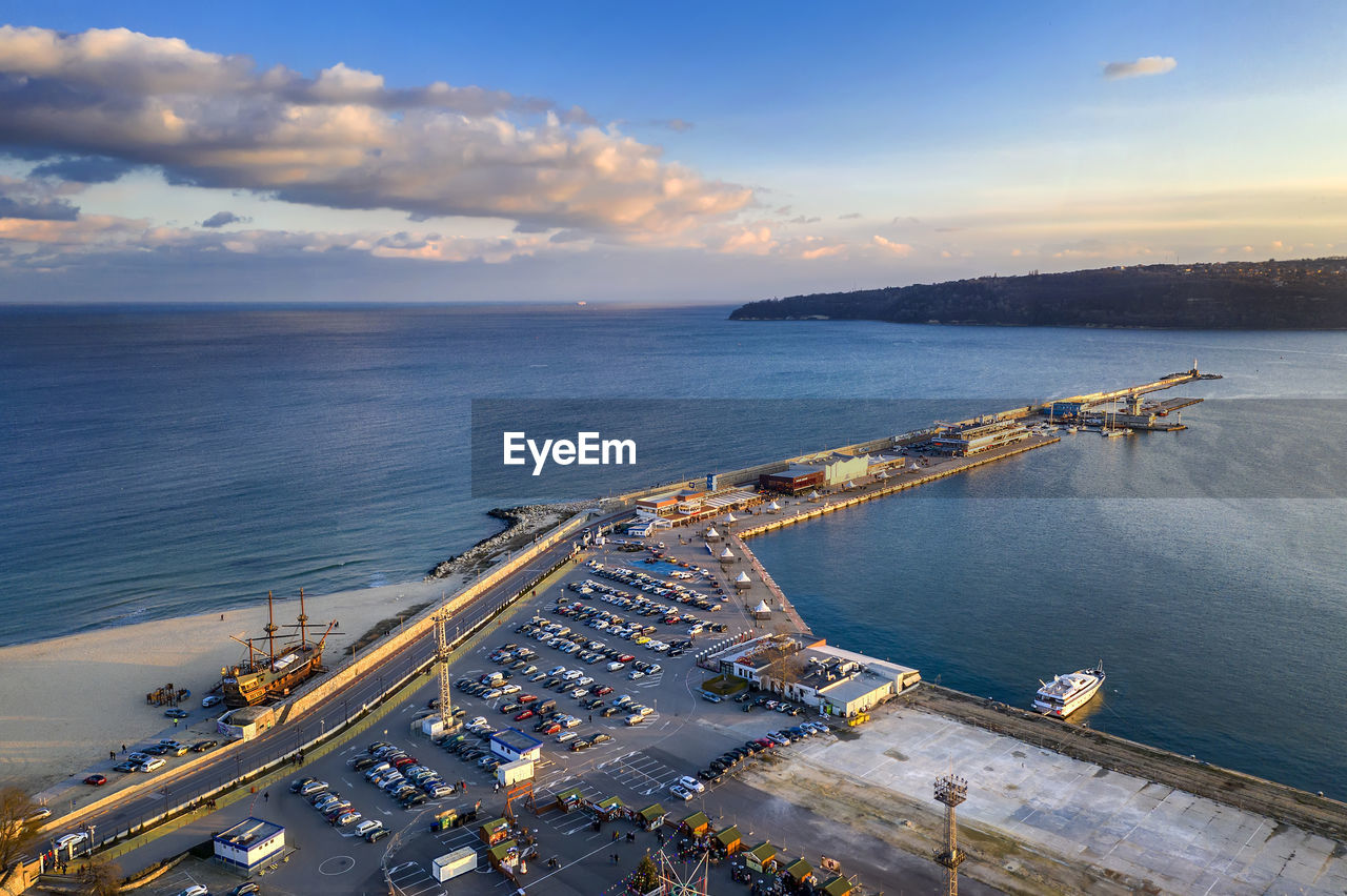Aerial view from drone of seaport and breakwater at the stunning sunset. black sea, varna, bulgaria