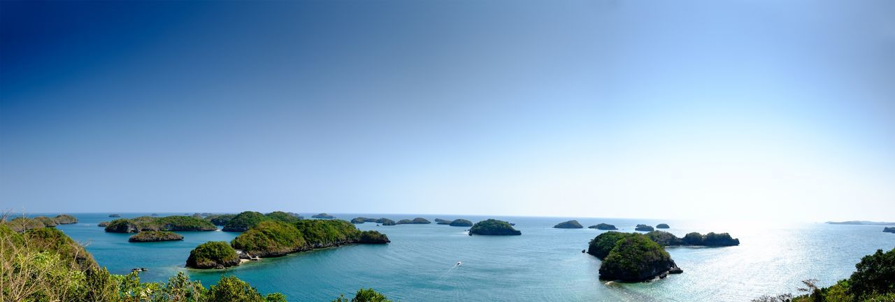 Scenic view of sea against clear blue sky