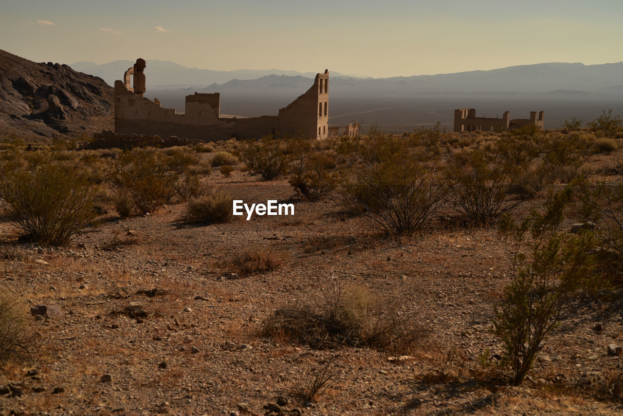 The former town of rhyolite in nevada is now a deteriorating ghost town