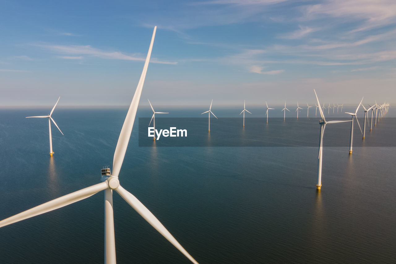 low angle view of wind turbines