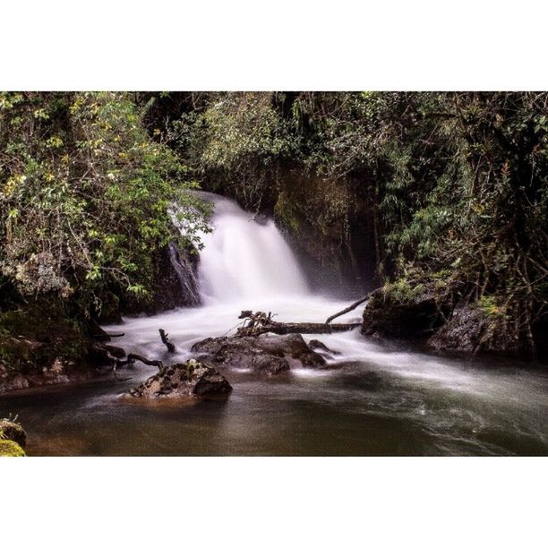 SCENIC VIEW OF RIVER FLOWING THROUGH ROCKS