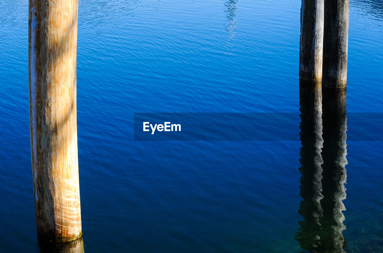 reflection, water, blue, no people, day, nature, sunlight, sea, wave, outdoors, ocean, tranquility, beauty in nature, rippled, high angle view
