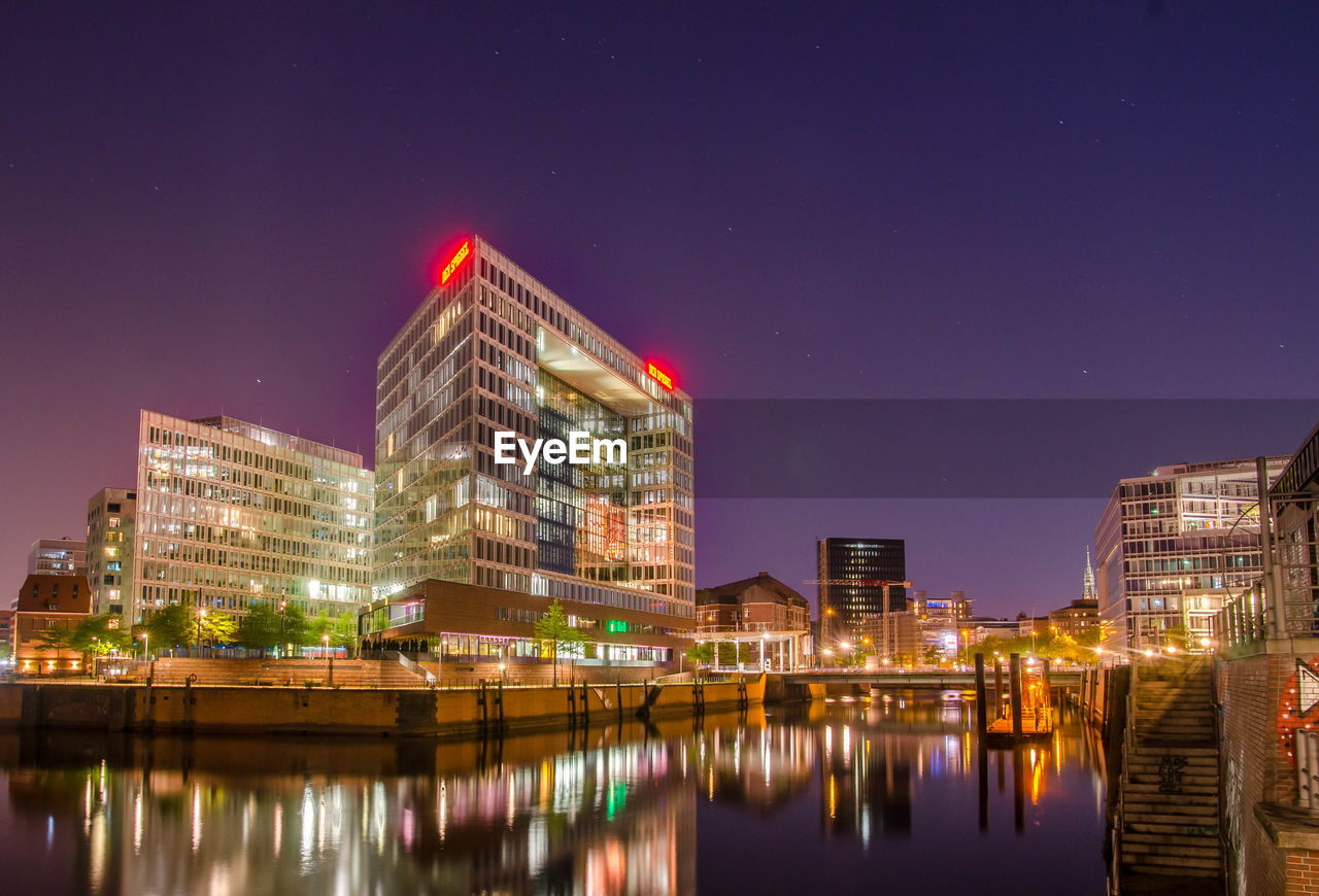 ILLUMINATED BUILDINGS AT NIGHT