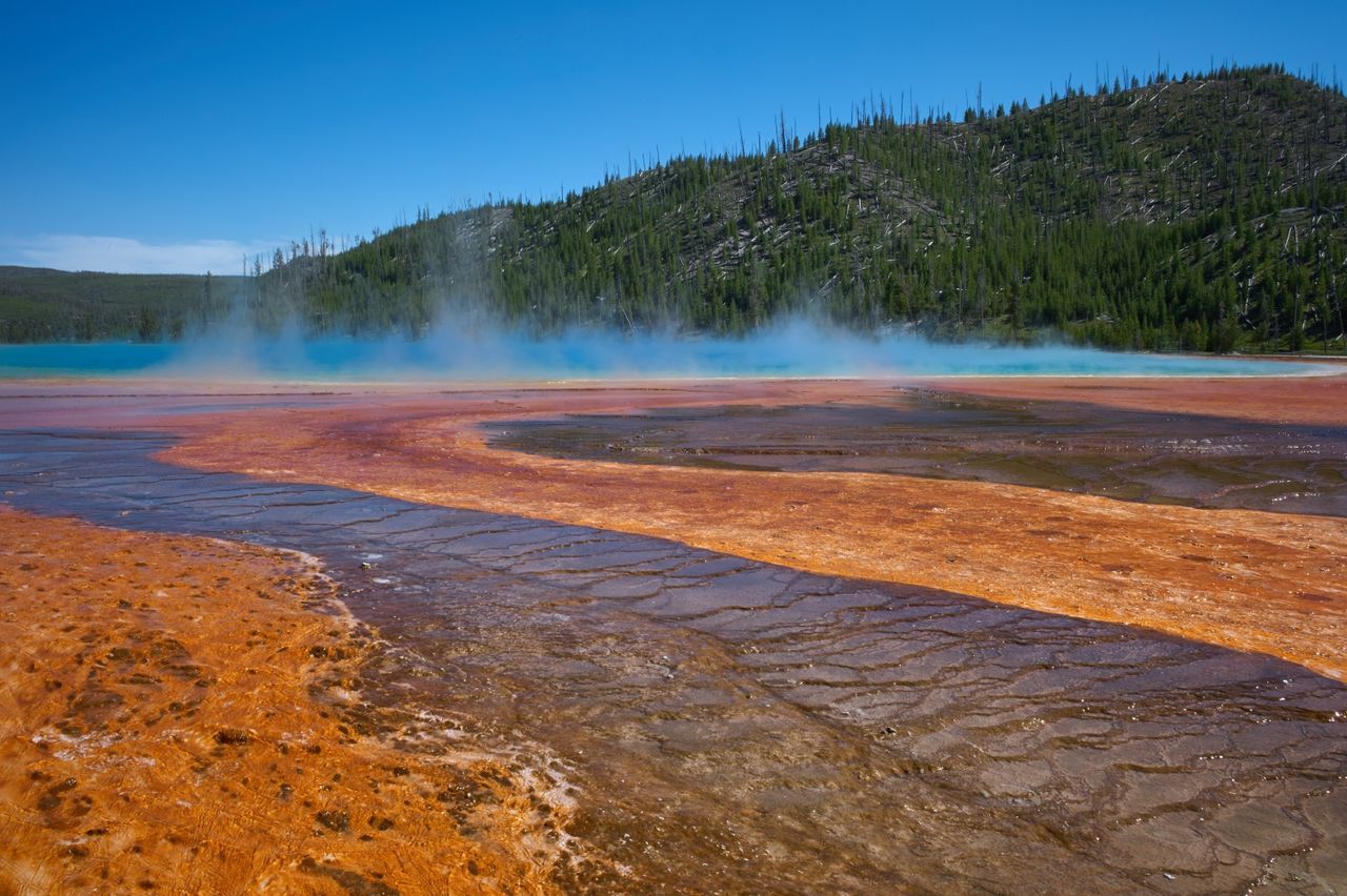 Scenic view of smoke emitting from hot spring