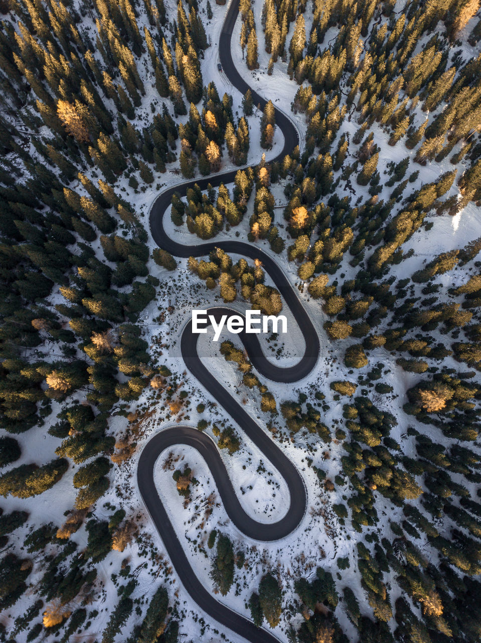 Aerial view of curved road at sunset.
snake road,dolomities,italy