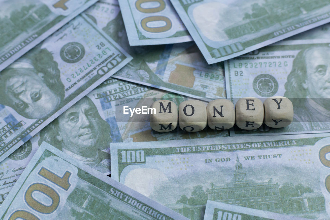 FULL FRAME SHOT OF COINS ON TABLE