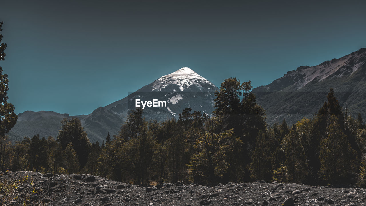 Scenic view of snowcapped mountains against clear sky