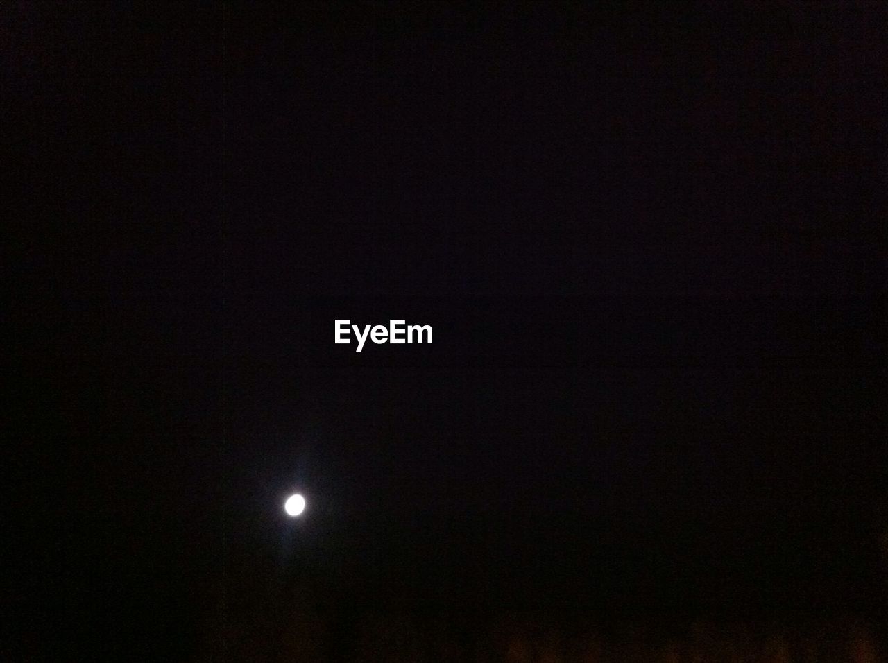 LOW ANGLE VIEW OF MOON IN THE SKY