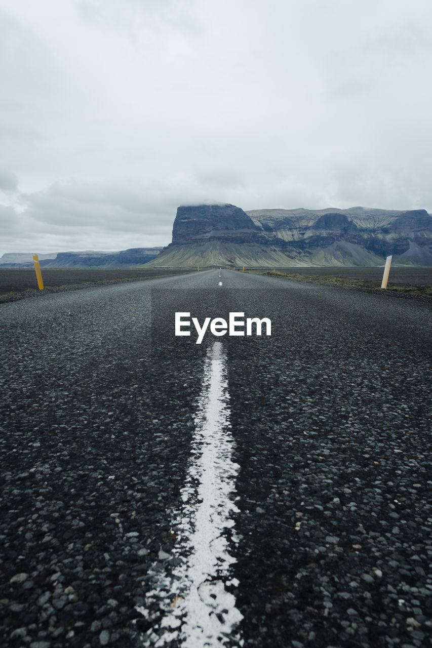 Surface level of empty road amidst land