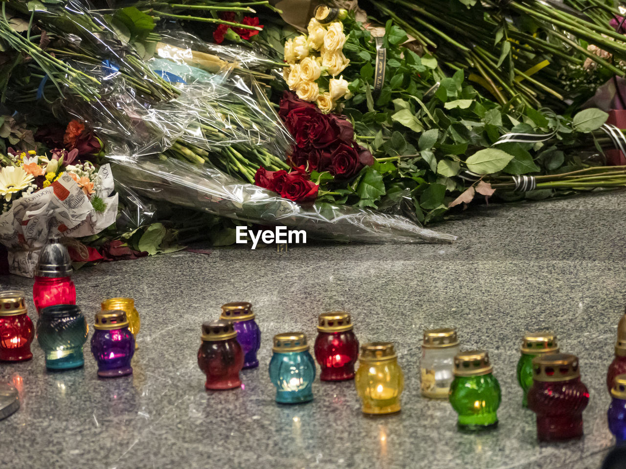 VARIOUS FLOWER POTS ON GLASS