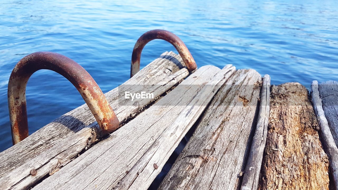 HIGH ANGLE VIEW OF RUSTY PIER