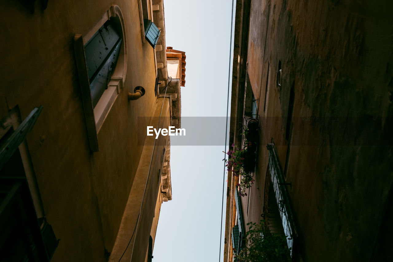 Low angle view of buildings against clear sky