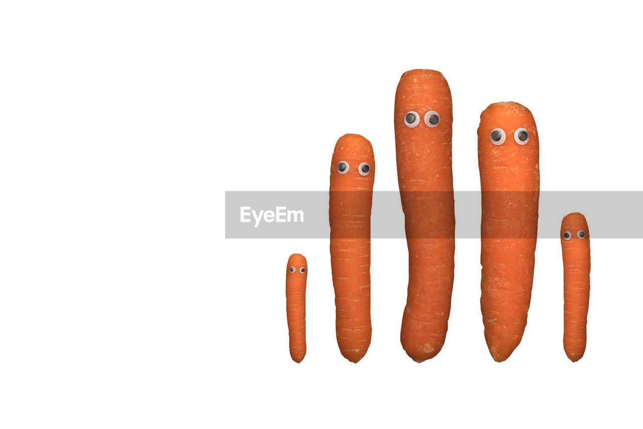 finger, carrot, white background, hand, studio shot, orange, cut out, indoors, orange color, root vegetable, close-up, baby carrot, copy space, creativity, food