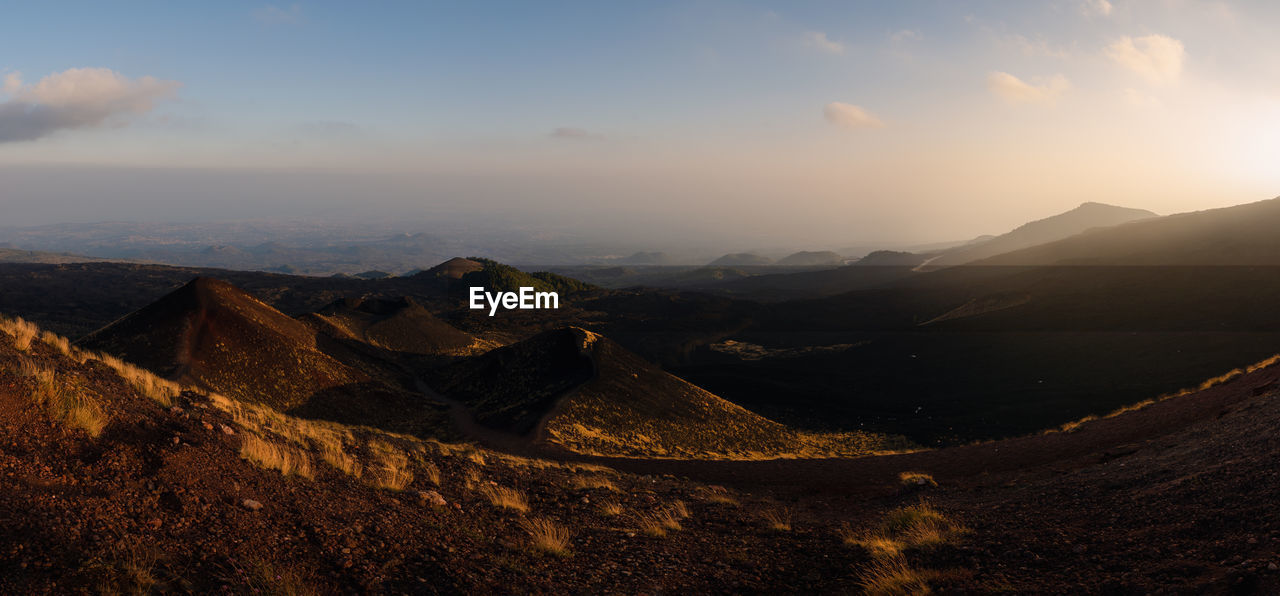 Scenic view of mountains against sky during sunset