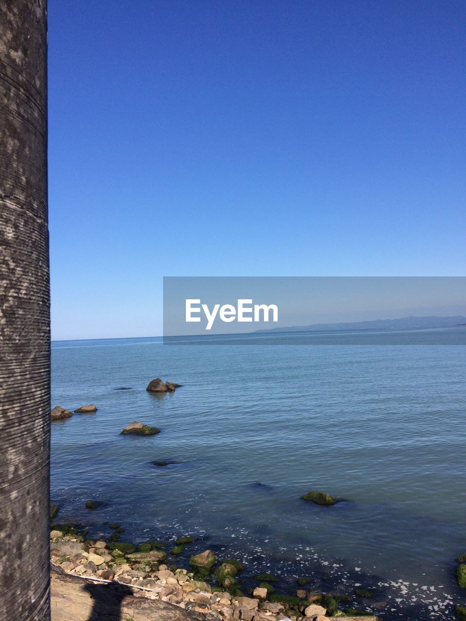 SCENIC VIEW OF SEA AGAINST BLUE SKY