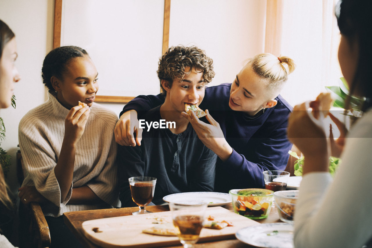 GROUP OF PEOPLE AT RESTAURANT