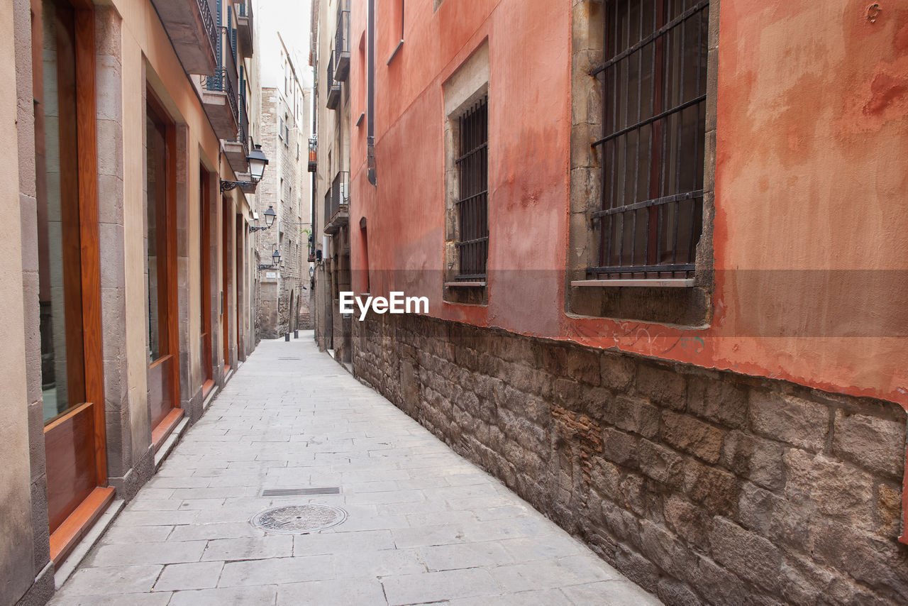 NARROW STREET AMIDST BUILDINGS