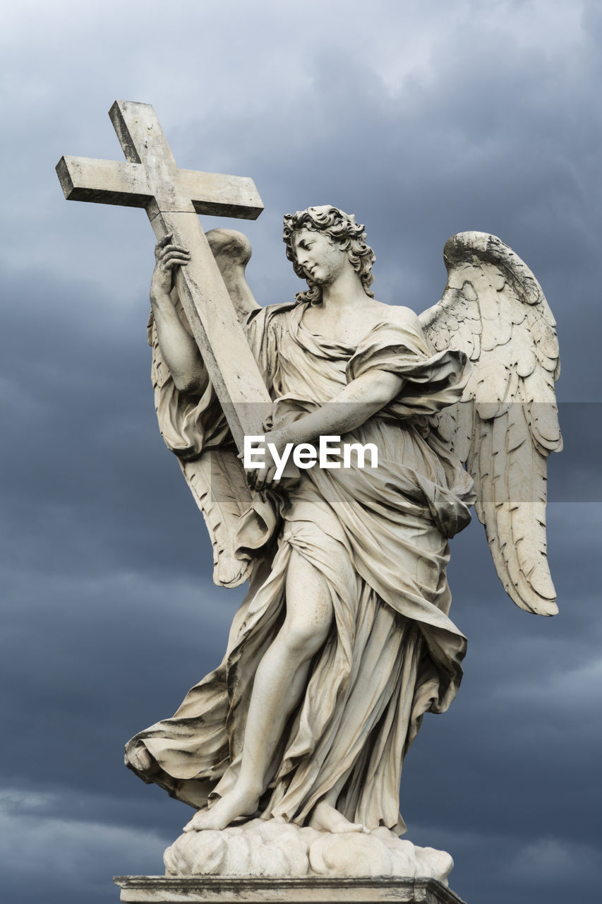 Low angle view of statue against sky