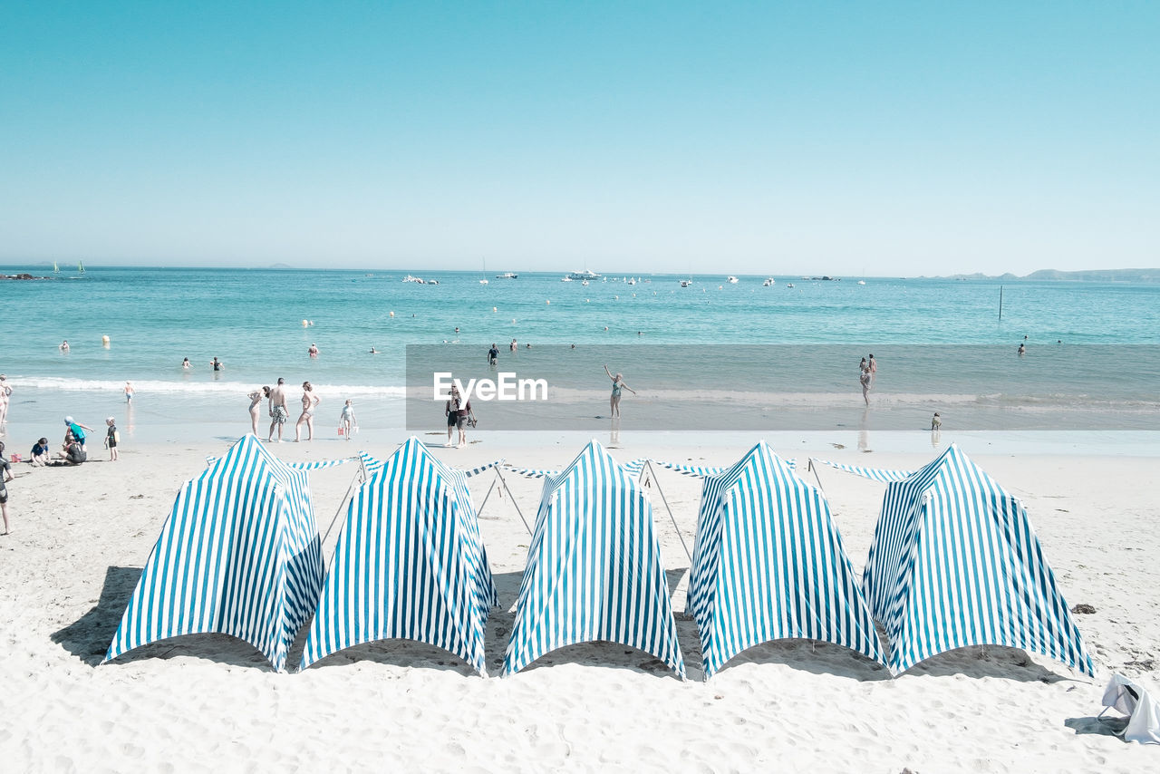 Scenic view of beach against clear sky