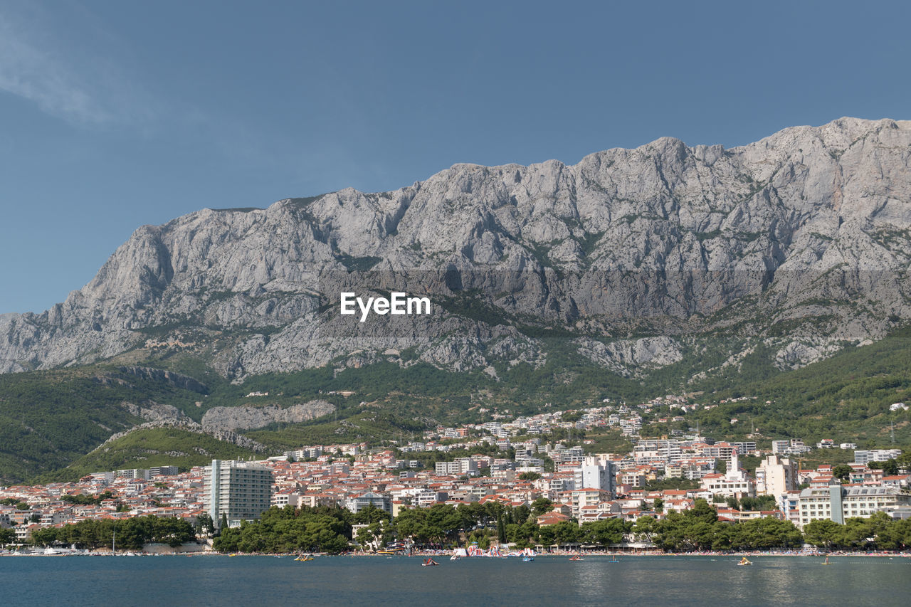 Landscape of makarska town in the adriatic sea coast under the biokovo mountain in croatia