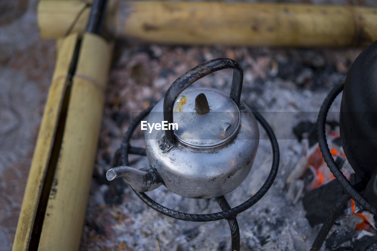 HIGH ANGLE VIEW OF FIRE ON BARBECUE