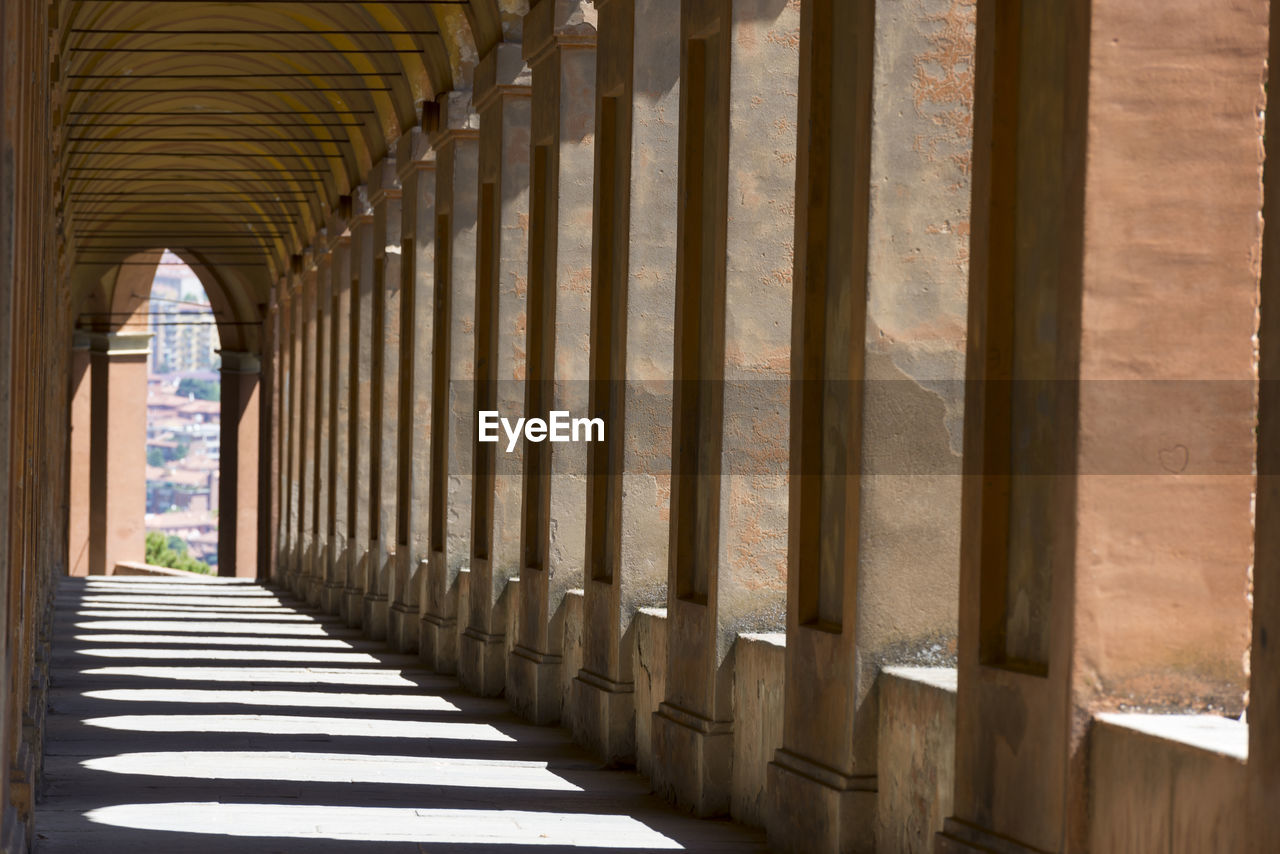 Long empty corridor along pillars