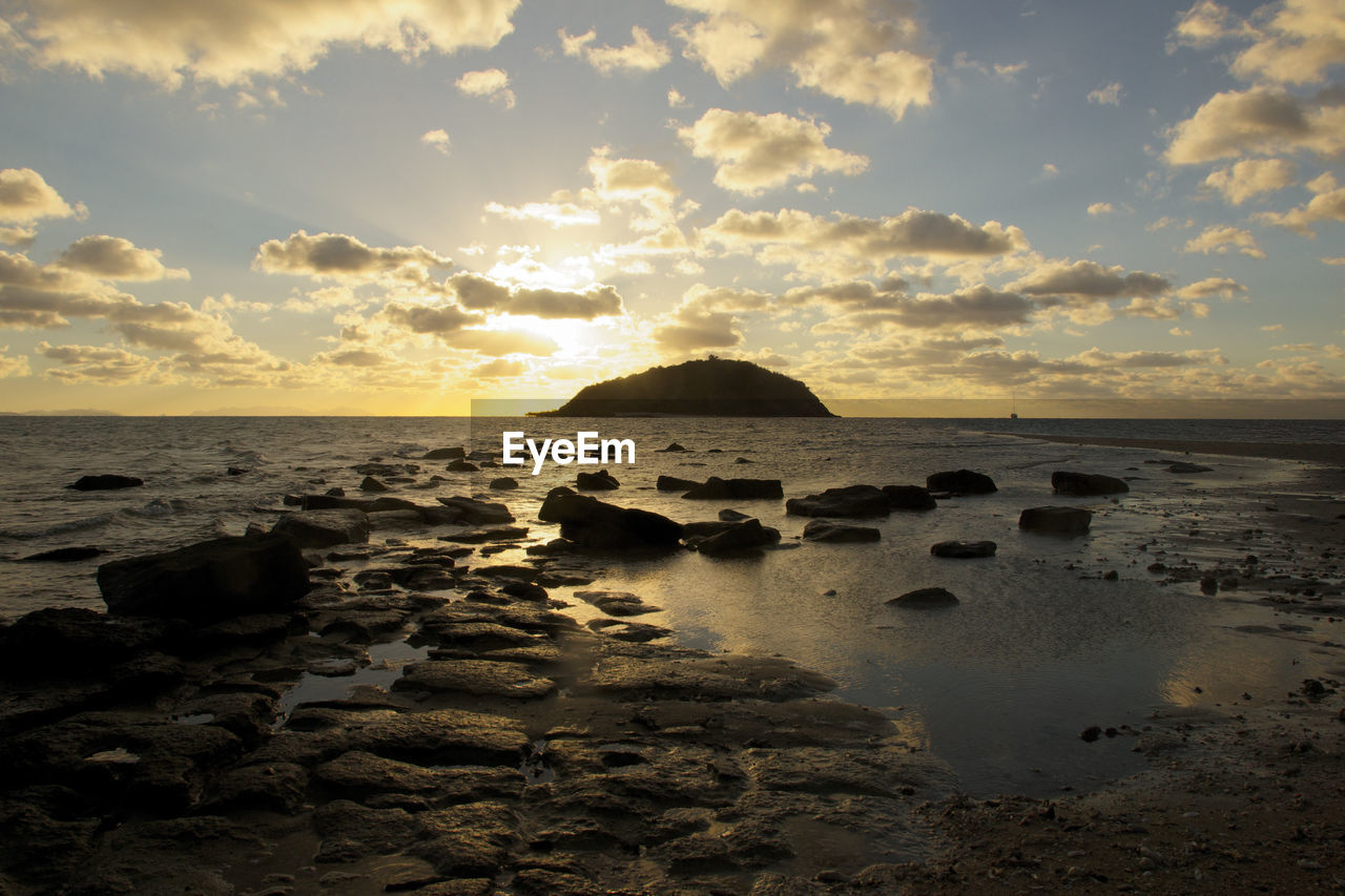 View of calm sea at sunset