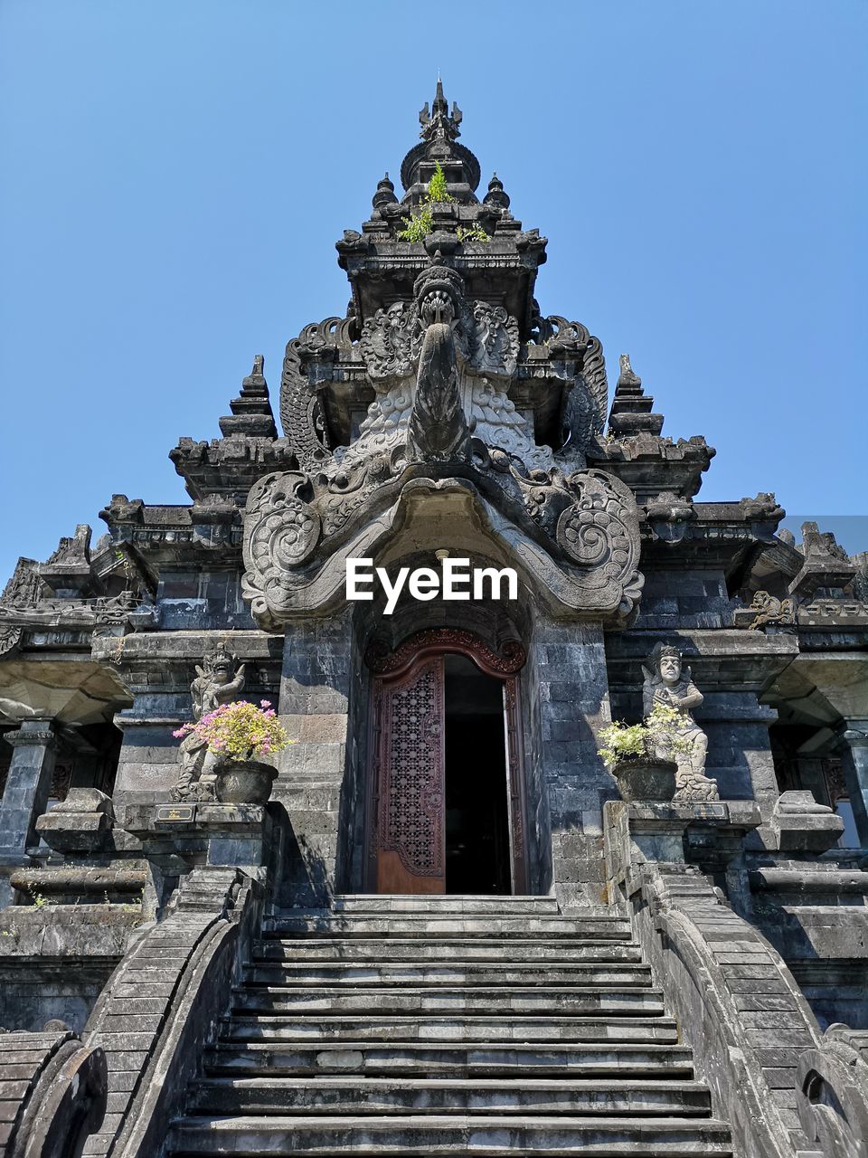 LOW ANGLE VIEW OF TEMPLE AGAINST CLEAR SKY