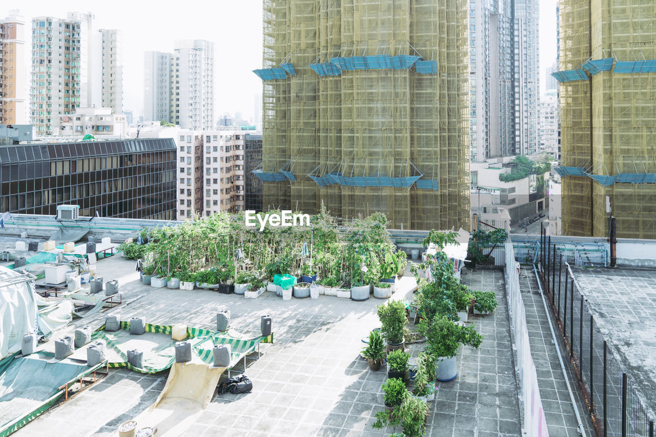 HIGH ANGLE VIEW OF MODERN GLASS BUILDINGS