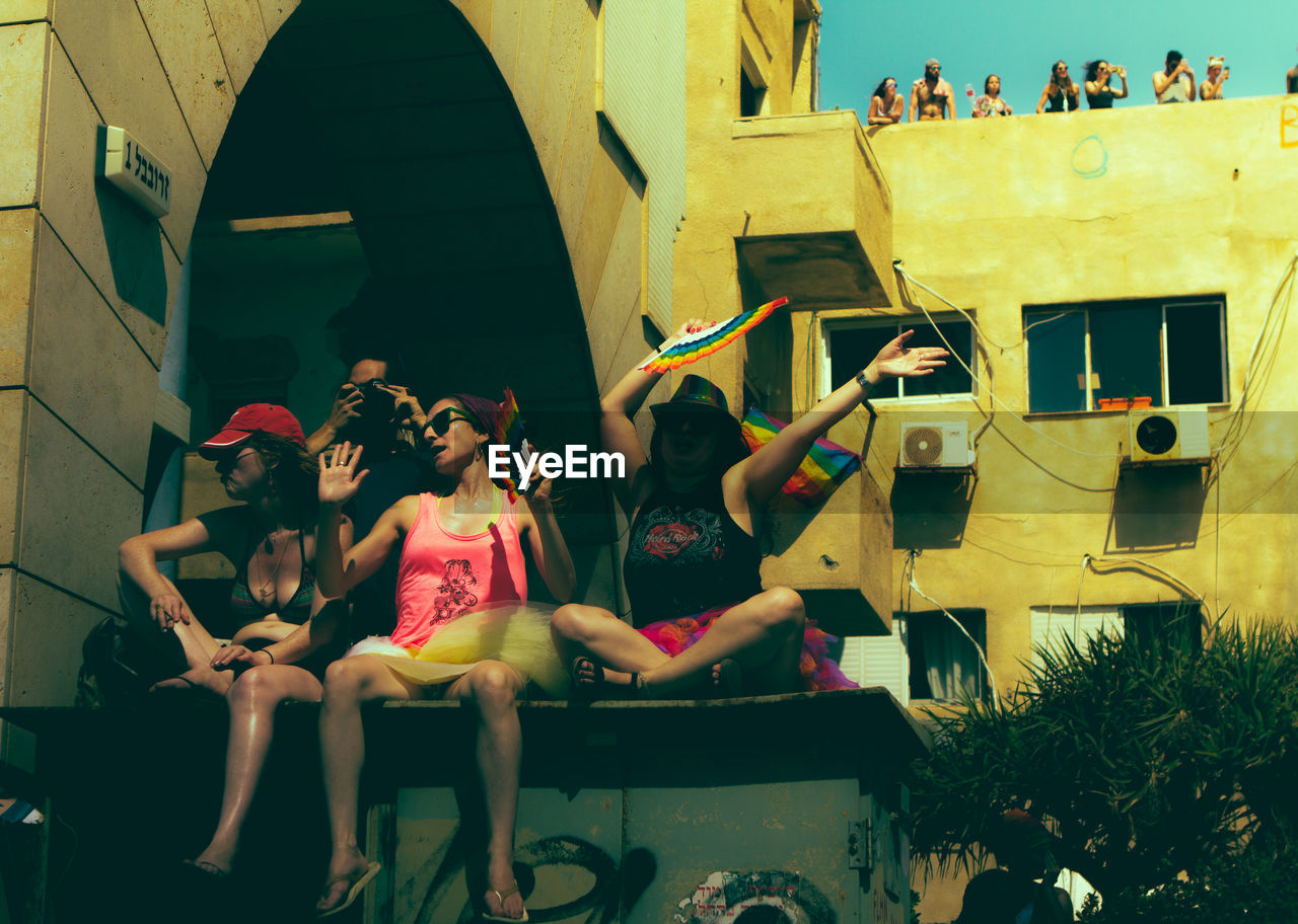 PEOPLE SITTING ON CHAIR AT MARKET