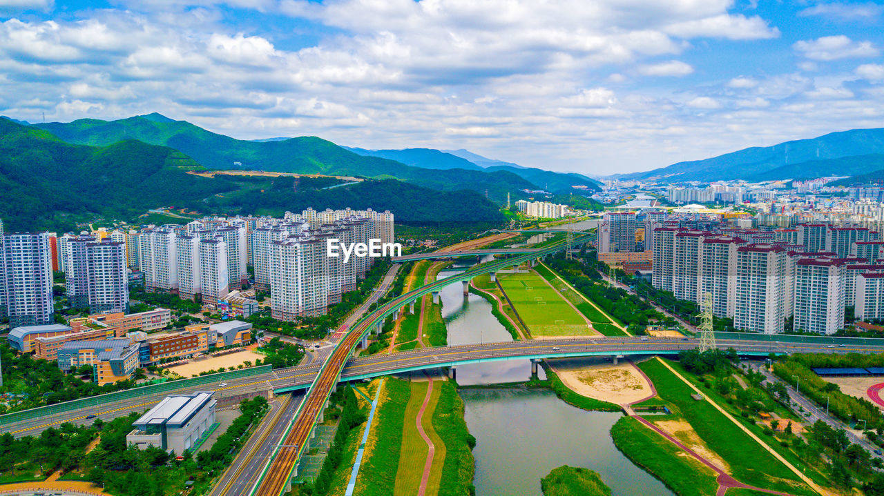 High angle view of city and buildings against sky