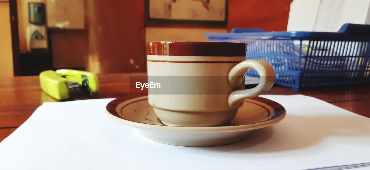 Close-up of coffee cup on table