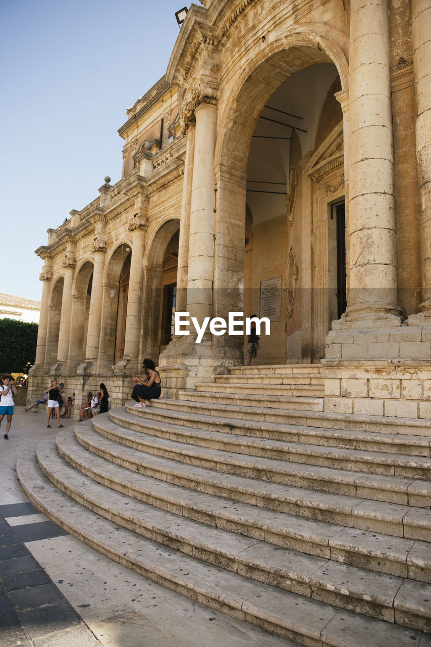 People at historical building