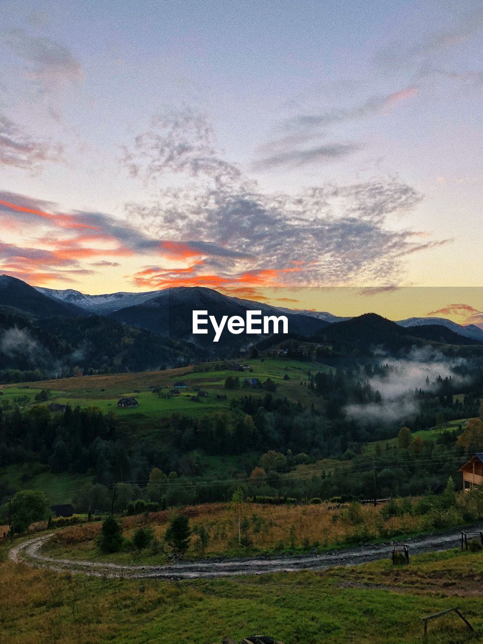 SCENIC VIEW OF LANDSCAPE AND MOUNTAINS AGAINST SKY