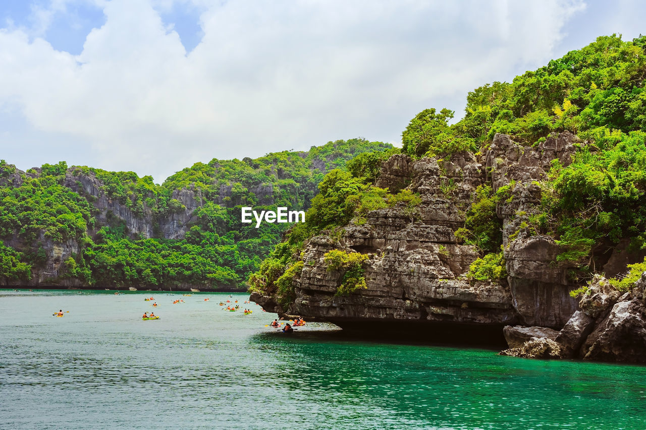 SCENIC VIEW OF SEA AND ROCKS AGAINST SKY